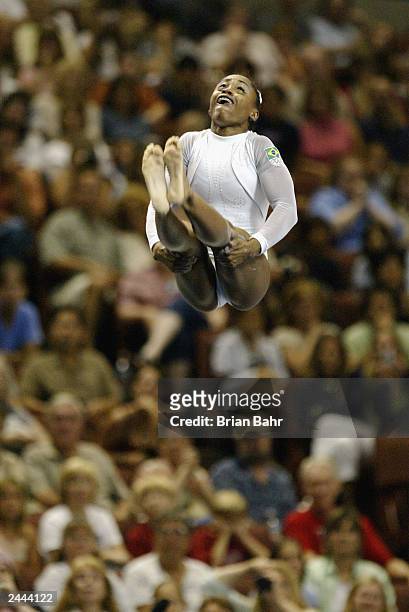 Daiane Dos Santos of Brazil competes in the Women's floor exercises during the apparatus Finals of the 2003 World Gymnastics Championships on August...