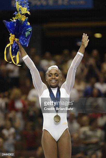 Daiane Dos Santos wins the gold medal in the Women's floor exercises during the apparatus Finals of the 2003 World Gymnastics Championships on August...