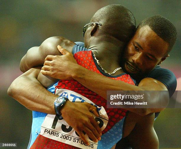 John Capel of USA and Darvis Patton of USA celebrate after the men's 200m final at the 9th IAAF World Athletics Championships August 29, 2003 at the...