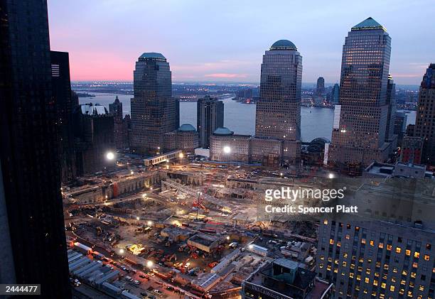 As the sun sets over New Jersey, cleanup and recovery efforts continue at the site of the World Trade Center disaster February 15, 2002 in New York...