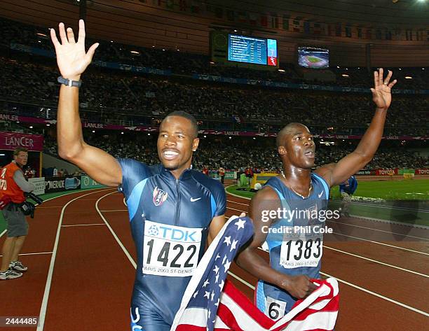 John Capel and Darvis Patton of the USA celebrate after winning gold and silver respectively in the men's 200m final at the 9th IAAF World Athletics...