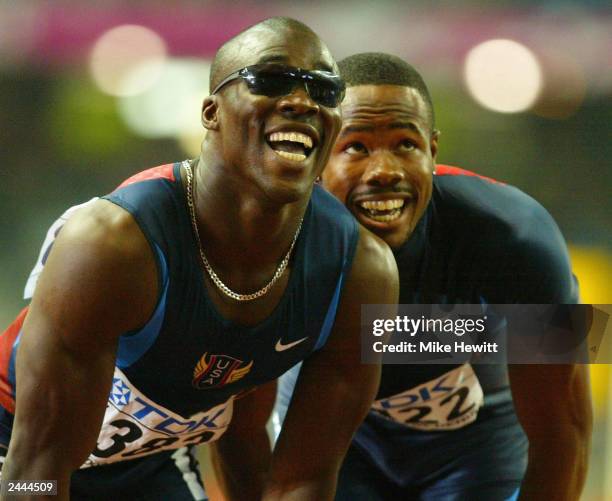 John Capel and Darvis Patton , both from the USA look at the scoreboard after the men's 200m final at the 9th IAAF World Athletics Championships...