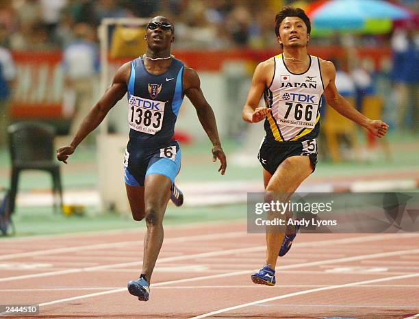 John Capel of the USA and Shingo Suetsugu of Japan finish first and third respectively during the men's 200m final at the 9th IAAF World Athletics...