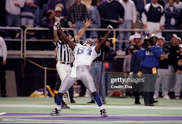 Wide receiver Herman Moore of the Detroit Lions celebrates after catching the game winning touchdown during the Lions 14-13 win over the Minnesota...