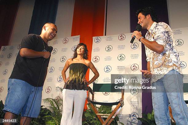 Latin singer Chayanne is questioned by Armaldo Tercero , a Miami Dade Community College sophomore, as Telemundo presenter Candela Ferro stands nearby...