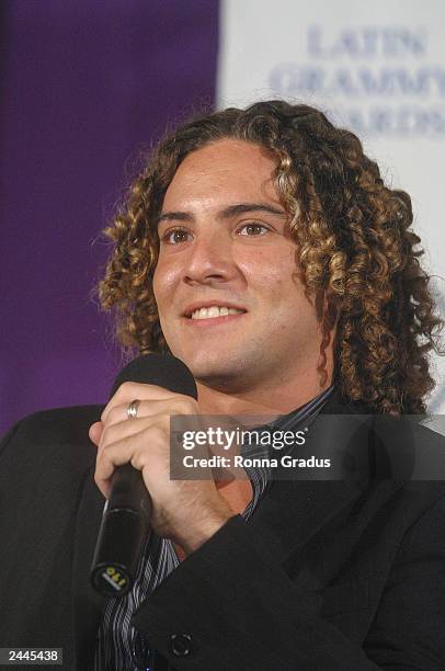 Singer David Bisbal answers questions during the e-Latin Grammy Carreras y Musica program at Miami Dade Community College August 29, 2003 in Miami,...