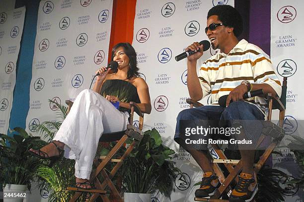 Singer Tego Calderon ansers questions as he is interviewed by Telemundo presenter Candela Ferro during the e-Latin Grammy Carreras y Musica program...
