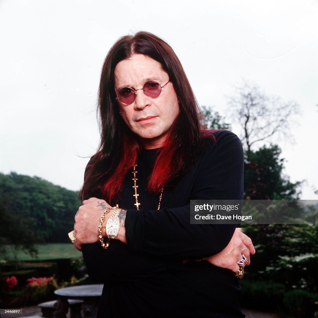 British musician Ozzy Osbourne poses for photographs at his mansion