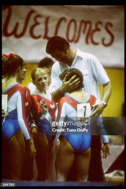 Mary Lou Retton of the United States gets a hug from her coach Bela Karolyi. Mandatory Credit: Tony Duffy /Allsport