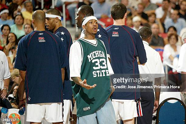 Allen Iverson of the USA stabds amongst his teammates during a break in the action as the USA plays Argentina during the gold Medal game of the...