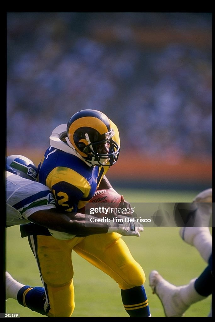 Running back Greg Bell of the Los Angeles Rams runs with the ball ...