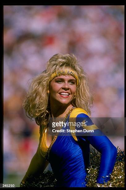 General view of a Los Angeles Rams cheerleader looking on during a game between the Rams and the San Francisco 49ers at Anaheim Stadium in Anaheim,...