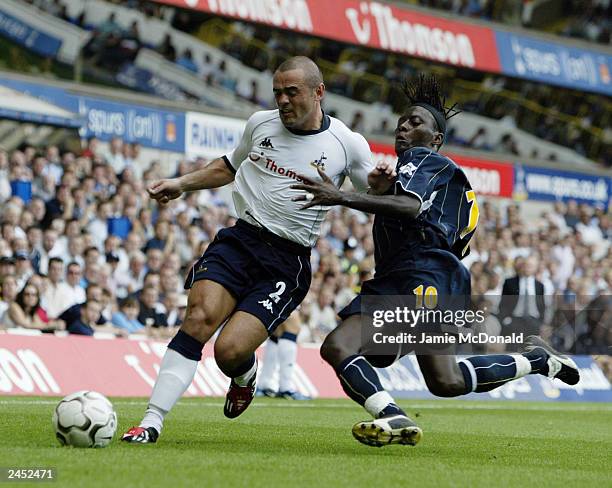 Stephen Carr of Tottenham Hotspur is challenged by Lamine Sakho of Leeds United during the FA Barclaycard Premiership match held on August 23 at...