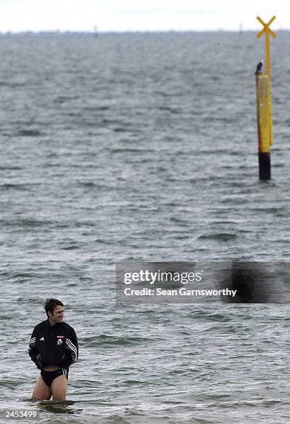 Collingwood player Shane Wakelin recovers during a Collingwood Magpies training session at St Kilda beach September 2, 2003 in Melbourne, Australia. .