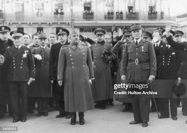 Spanish dictator General Francisco Franco during a visit to Vichy French leader Marshal Henri-Philippe Petain , circa 1942. Behind Franco is his...