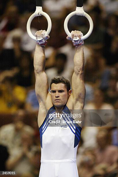 Blaine Wilson of the Unite States holds his position on the Men's sill rings during the Apparatus Finals of the 2003 World Gymnastics Championships...