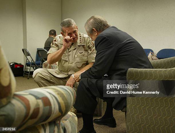 Retiring Commander of CENTCOM General Tommy Franks meets with Secretary of Defense Donald Rumsfeld before his change-of-command ceremony July 7, 2003...