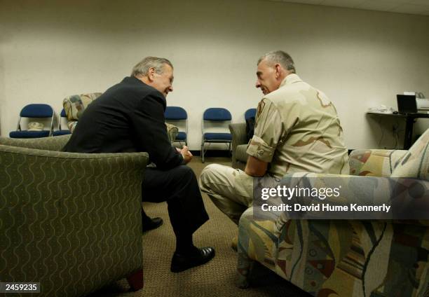 Retiring Commander of CENTCOM General Tommy Franks meets with Secretary of Defense Donald Rumsfeld before his change-of-command ceremony July 7, 2003...