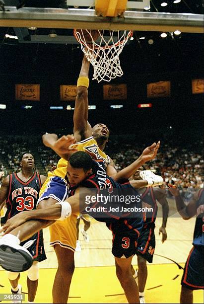 Forward Robert Horry of the Los Angeles Lakers tries to block guard John Starks of the New York Knicks during a game at the Great Western Forum in...