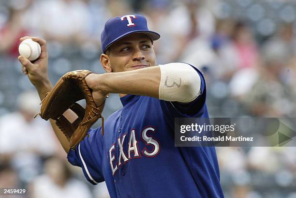 Alex Rodriguez of the Texas Rangers throws the ball against the Chicago White Sox at the Ballpark in Arlington on August 17, 2003 in Arlington,...