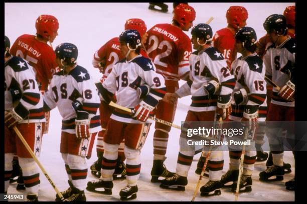 General view of teams from the United States and the Soviet Union shaking hands after the semifinal hockey game during the Winter Olympics in Lake...