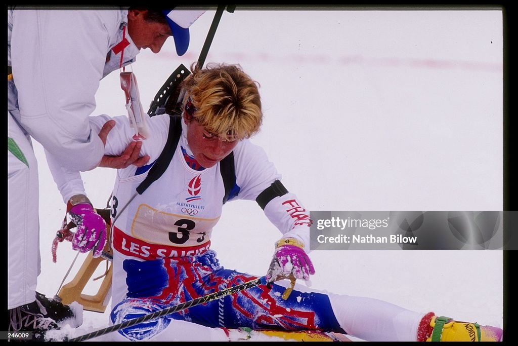 Anne Briand of France collaspes during the women''s biathlon during