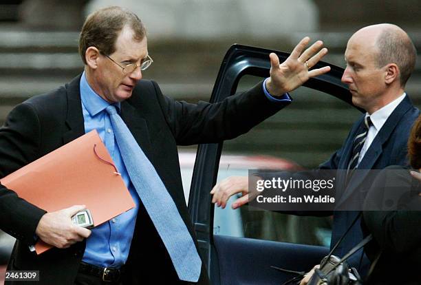 Downing Street spokesmen Tom Kelly and Godric Smith arrive at the high court to give evidence at the Hutton inquiry on August 20, 2003 in London,...