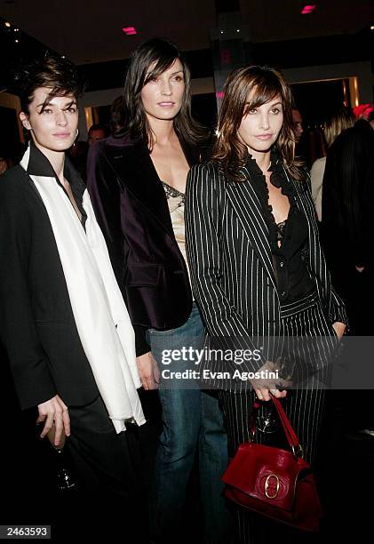 Model Amanda Moore, actress Famke Janssen and actress Gina Gershon attend the Yves Saint Laurent Rive Gauche 57th Street Boutique Opening Party...