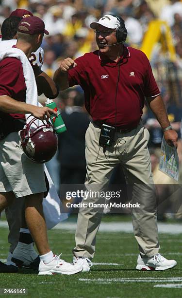 Head coach Mike DeBord of the Central Michigan Chippewas, former offensive coordinator for University of Michigan Wolverines, smiles to strong safety...