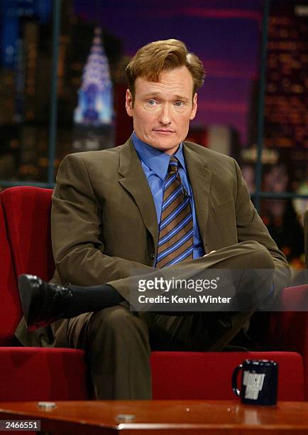 Talk show host Conan O'Brien appears on "The Tonight Show with Jay Leno" at the NBC Studios September 5, 2003 in Burbank, California.