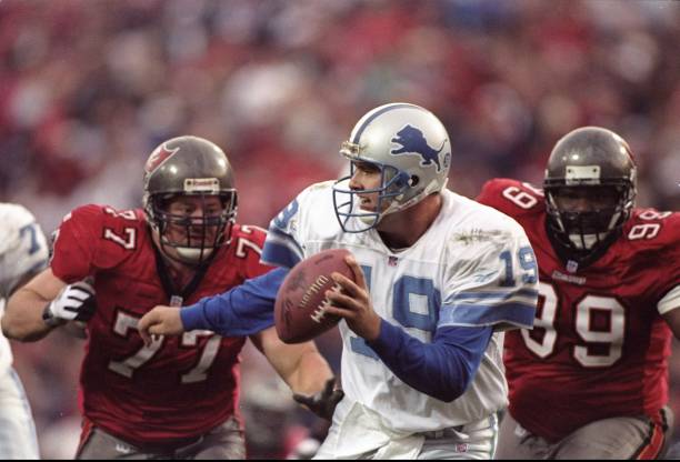 Defensive tackles Brad Culpepper and Warren Sapp of the Tampa Bay Buccaneers put the pressure on quarterback Scott Mitchell of the Detroit Lions...