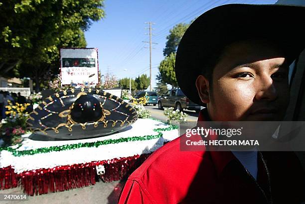 Man waits to board his float from "Tacos Mexico" in East Los Angeles, CA while he awaits the beginning of the parade celebrating the independence of...