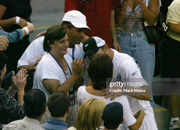 Actress Mandy Moore speaks with tennis player Andy Roddick after he won the "2003 US Open Men's Finals" September 7, 2003 in Flushing, New York.