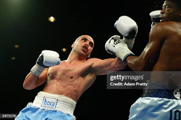 Anthony Mundine of Australia hits Antwun Echols of the USA during the WBA Super Middleweight World Title Fight between Anthony "The Man" Mundine and...