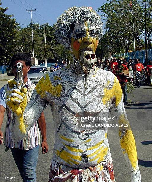 An East Timorese participates ino a festival to celebrate an anniversary of East Timor referendum day in Dili, 30 August 2003. An estimated 1,000...