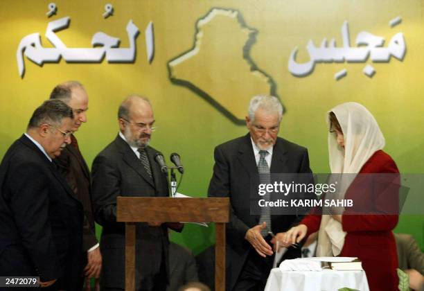 Public Works minister and the only woman in the new cabinet, Nisrin Mustafa al-Barwari is sworn in 03 September 2003 in Baghdad in the presence of...