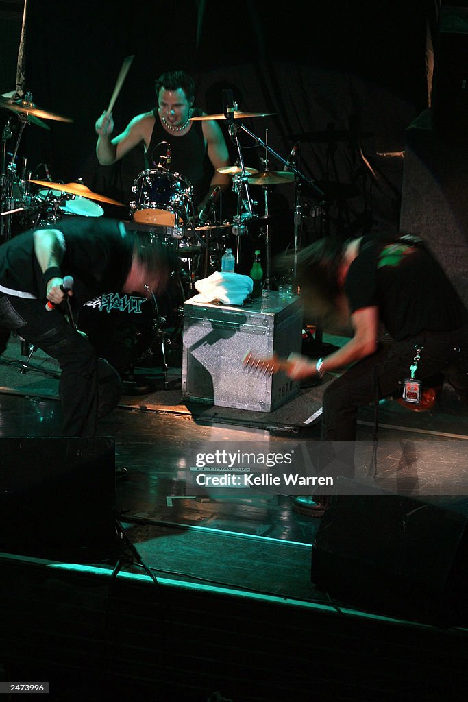 Singer Janci Lead singer Jani Lane and guitarist Billy Morris of Warrant headbang ...