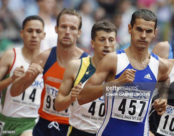 France's Mehdi Baala places second, ahead of Australia's Youcef Abdi , Dutch runner Gert-Jan and Algeria's Tarek Boukensa in heat one of the men's...