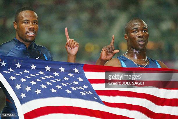 Men's 200m gold medal winner John Capel of the US and compatriot silver medal winner Darvis Patton pose for photographers 29 August 2003, during the...