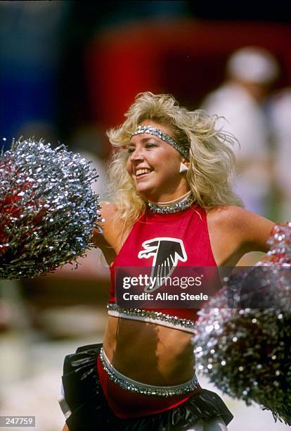 General view of a cheerleader for the Atlanta Falcons during a game against the Los Angeles Rams at Fulton County Stadium in Atlanta, Georgia. The...