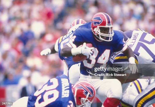 Running back Thurman Thomas of the Buffalo Bills runs with the ball during a game against the Minnesota Vikings at Rich Stadium in Orchard Park, New...