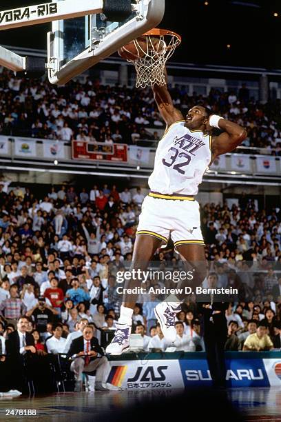 Karl Malone of the Utah Jazz drives in for a dunk against the Phoenix Suns during the 1990 Japan Games at the Tokyo Dome in Tokyo, Japan. NOTE TO...