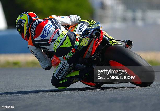 Italian Moto GP rider Valentino Rossi takes a curve with his Honda during Free Practice nr 1 for the Moto Grand Prix of Portugal in Estoril, near...