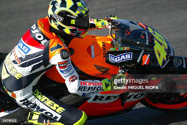 Italian Moto GP rider Valentino Rossi takes a curve with his Honda during Free Practice nr 1 for the Moto Grand Prix of Portugal in Estoril, near...