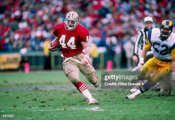 Fullback Tom Rathman of the San Francisco 49ers runs down the field ...