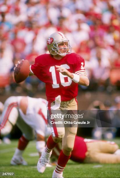 Quarterback Joe Montana of the San Francisco 49ers rolls out of the pocket during a game against the Atlanta Falcons at Candlestick Park in San...