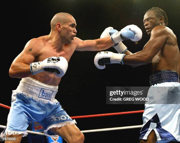 Australia's Anthony Mundine lands a punch on Antwun Echols of the US during the vacant World Boxing Association super middleweight title fight in...