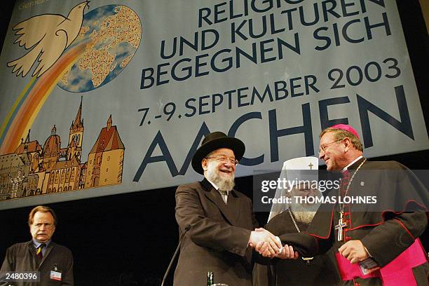 Israeli Rabi Meir Lau , Russian Orthodox Priest Metropolitan Kyrill and Aachen's Catholic Bishop Heinrich Musinghoff greet each other during the...