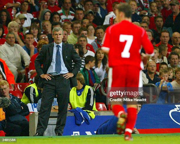 Manager Mark Hughes of Wales looks at Jason Koumas of Wales as he leaves the field after being sent off during the Euro 2004 Qualifier Group 9 match...