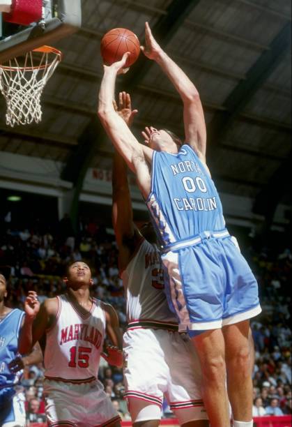 Center Eric Montross of the North Carolina Tar Heels shoots the ball during a game against the Maryland Terrapins at the Cole Field House in College...